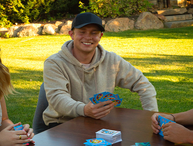 Dude smiling while playing party game artisimo